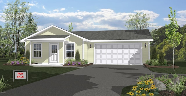 2715 Sawyer Rd, Traverse City, MI 49685 - view of front of house featuring driveway, a garage, and a front yard