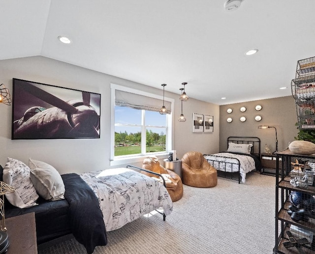 bedroom with carpet flooring and vaulted ceiling