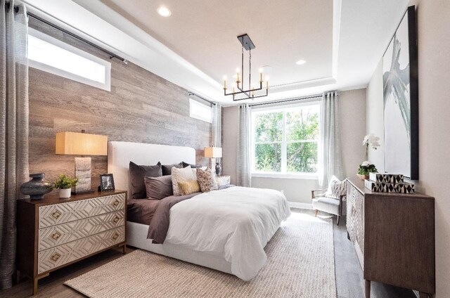 7889 Arimoore Dr, West Bloomfield, MI 48322 - bedroom with a chandelier, recessed lighting, wood finished floors, and a raised ceiling