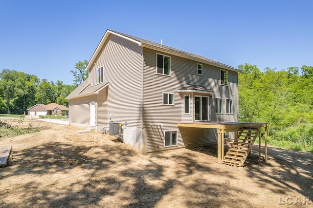 rear view of property with cooling unit