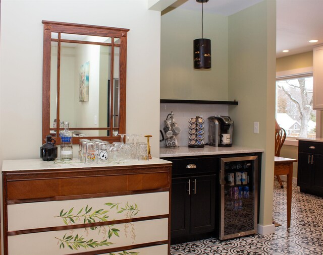 122 Park Ave, Frankfort, MI 49635 - bathroom with beverage cooler, backsplash, vanity, and recessed lighting