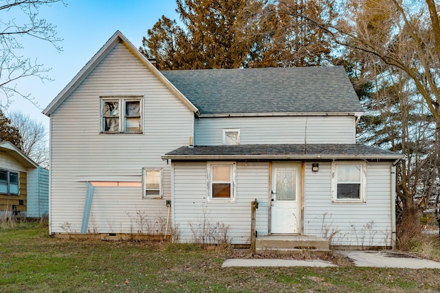 back of house featuring a yard