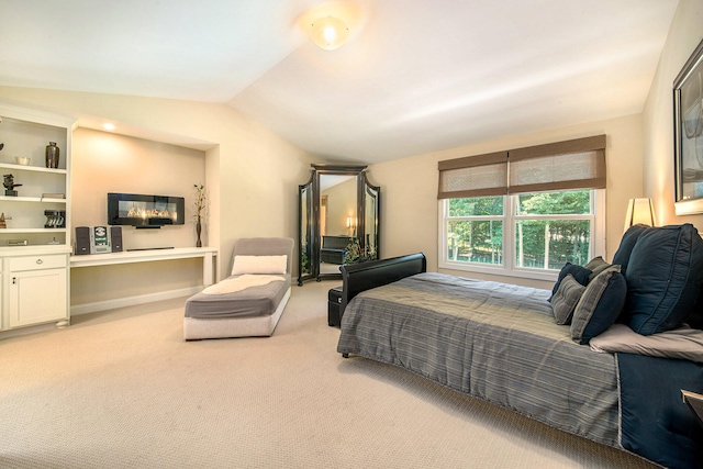 carpeted bedroom with vaulted ceiling