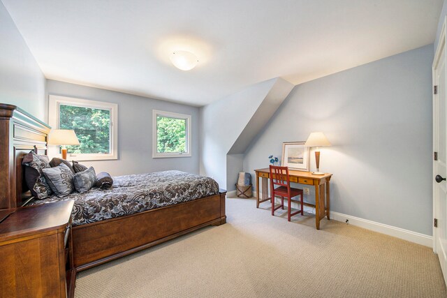 bedroom featuring light carpet