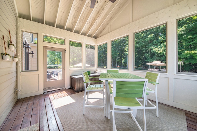 sunroom featuring vaulted ceiling