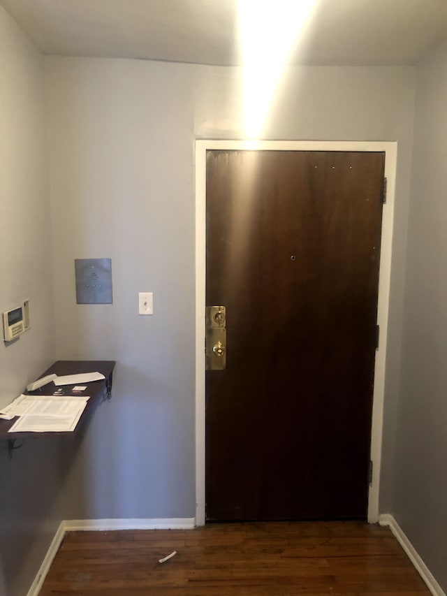 hallway featuring dark hardwood / wood-style floors