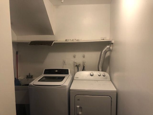 clothes washing area featuring independent washer and dryer