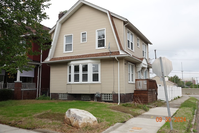 view of home's exterior featuring a lawn