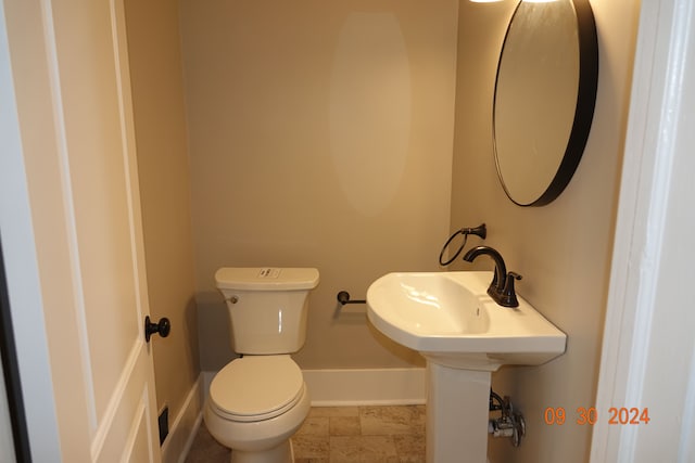 bathroom featuring toilet