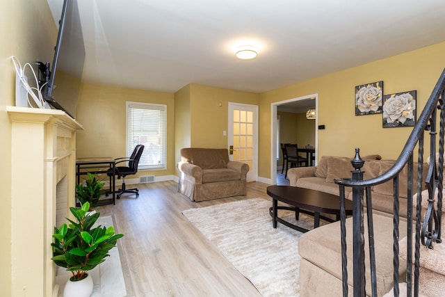 living room with light hardwood / wood-style floors