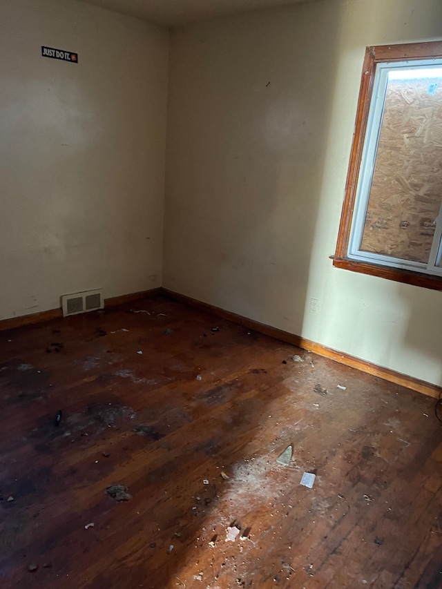 unfurnished room featuring dark hardwood / wood-style floors