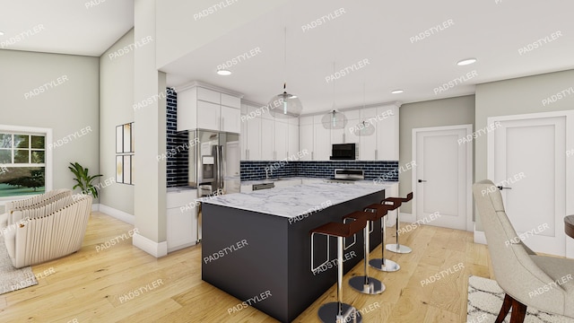 kitchen with appliances with stainless steel finishes, pendant lighting, decorative backsplash, a kitchen island, and white cabinetry