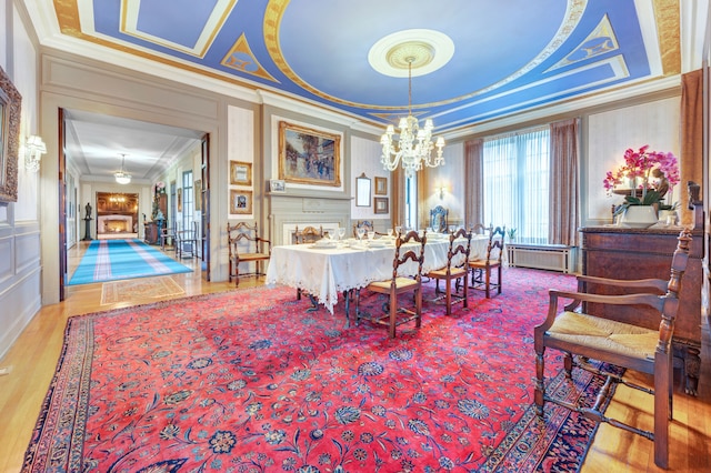 70 W Boston Blvd, Detroit, MI 48202 - bedroom with crown molding, a decorative wall, a chandelier, radiator heating unit, and wood finished floors