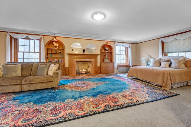 bedroom with crown molding and carpet floors