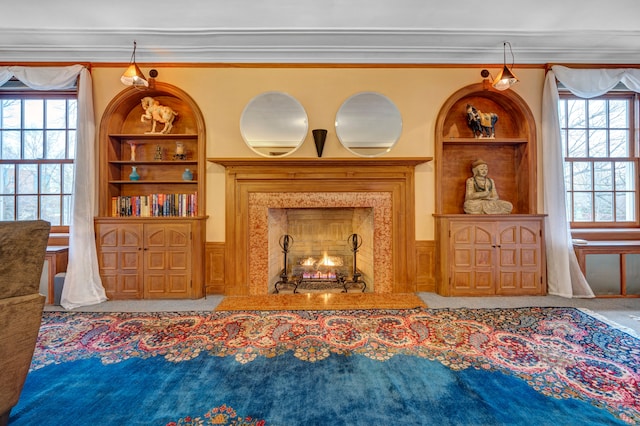 70 W Boston Blvd, Detroit, MI 48202 - carpeted living area with built in shelves, crown molding, healthy amount of natural light, and wainscoting