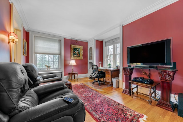 living room featuring hardwood / wood-style floors and ornamental molding