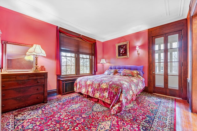 70 W Boston Blvd, Detroit, MI 48202 - bedroom featuring ornamental molding, wood finished floors, and french doors