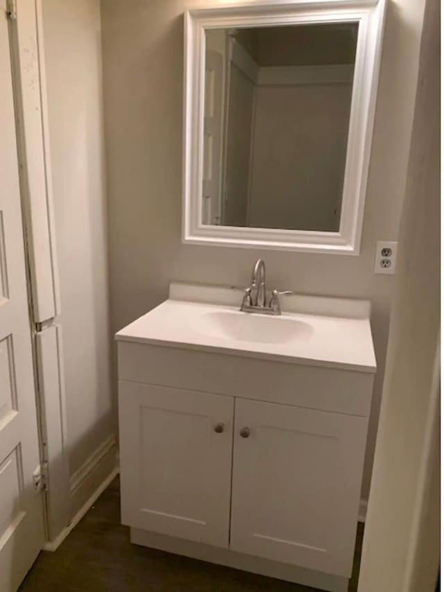 121 S Court St, Howell, MI 48843 - bathroom with vanity and baseboards