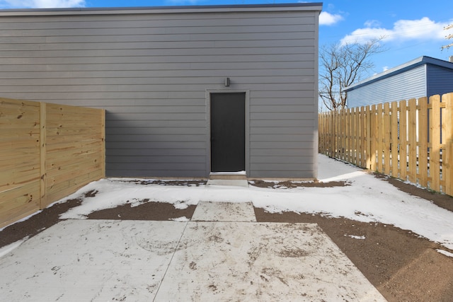 view of snow covered property entrance