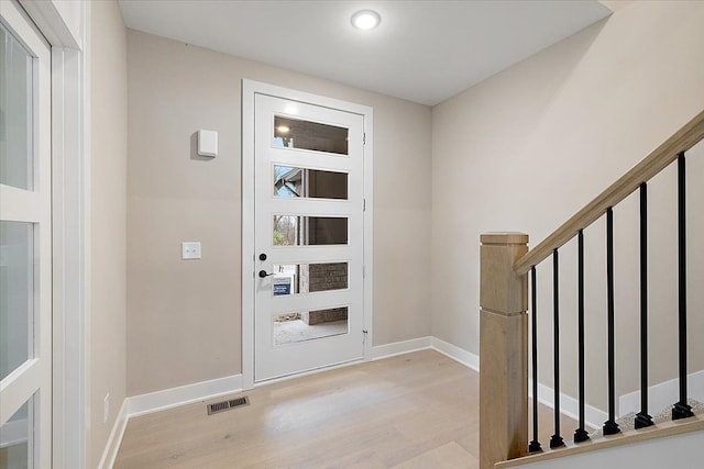 entryway with light hardwood / wood-style floors