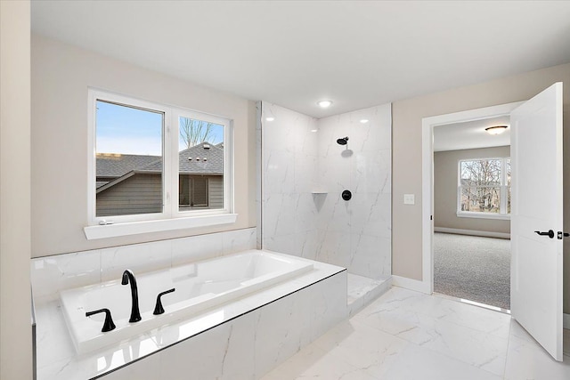 bathroom featuring shower with separate bathtub and a wealth of natural light