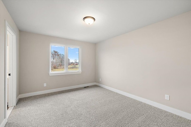 empty room with carpet flooring