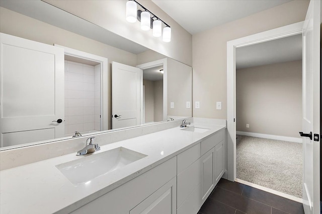 bathroom with tile patterned floors and vanity