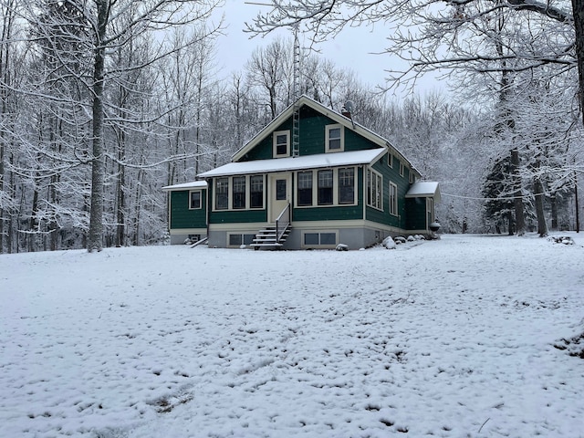 9516 State Highway M64, Marenisco, MI 49947 - snow covered property with a chimney and entry steps