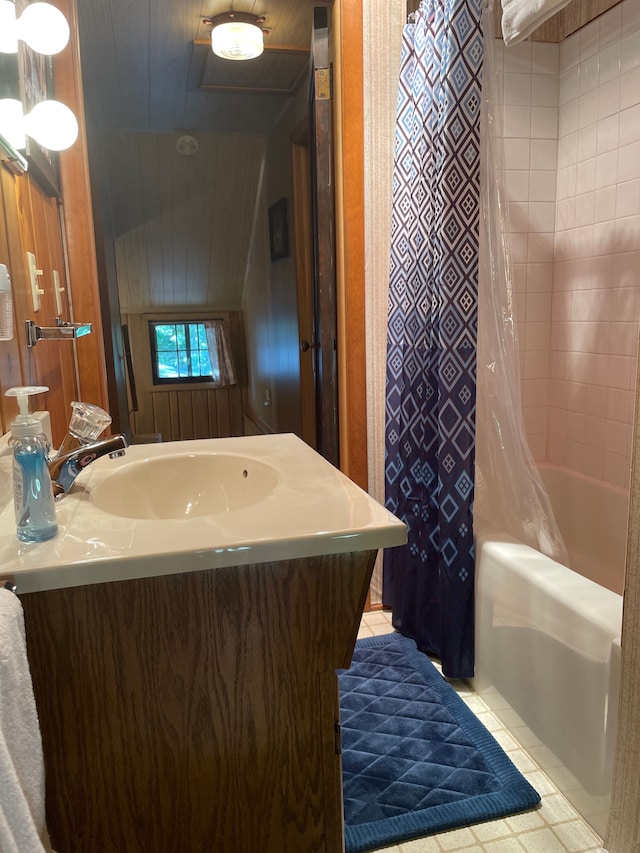 bathroom featuring sink, shower / bath combo, and tile patterned flooring