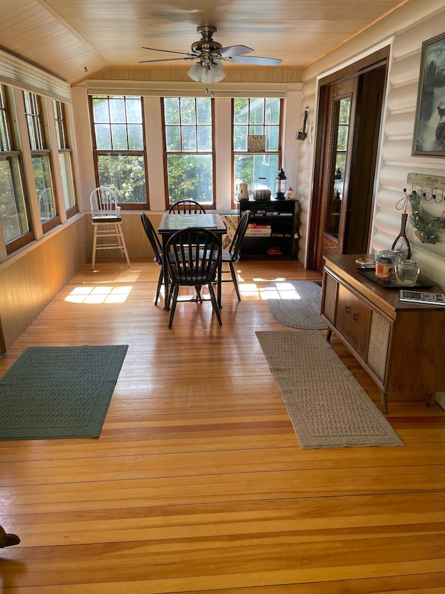 sunroom / solarium featuring ceiling fan, lofted ceiling, and wooden ceiling