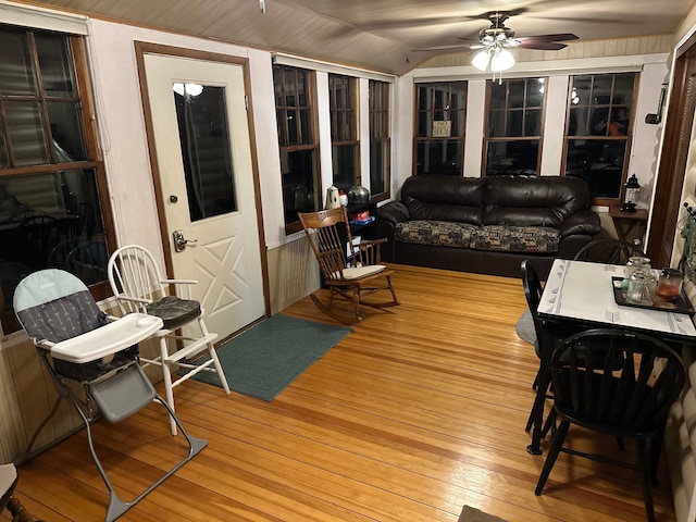 sunroom with ceiling fan and lofted ceiling