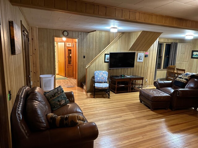 9516 State Highway M64, Marenisco, MI 49947 - living area featuring stairs, wood-type flooring, and wood walls