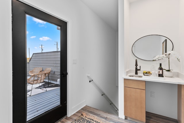 doorway featuring dark hardwood / wood-style flooring and sink