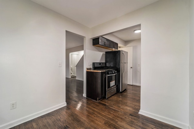 kitchen featuring dark wood-type flooring and appliances with stainless steel finishes