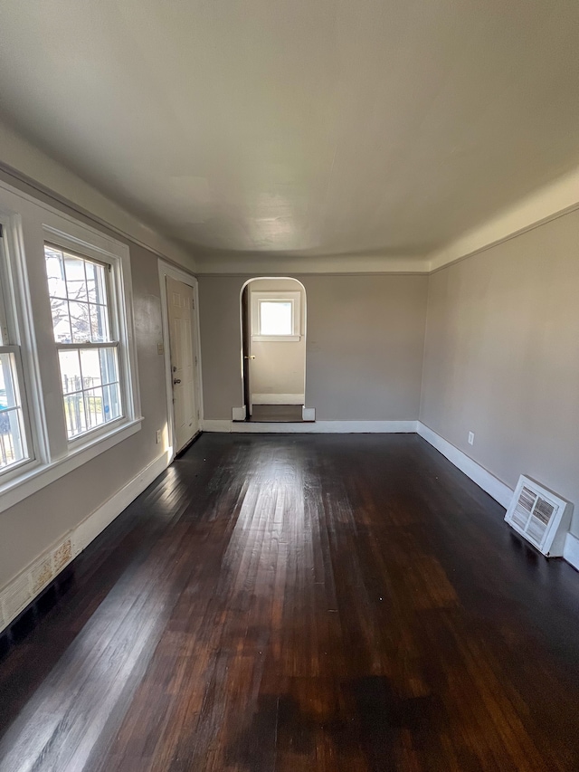 empty room featuring dark wood-type flooring