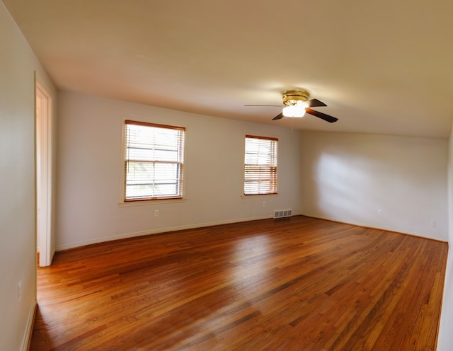 spare room with wood-type flooring and ceiling fan