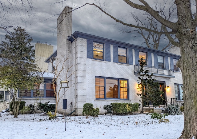 view of front of house with a balcony