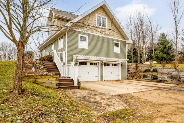 view of side of property with a garage