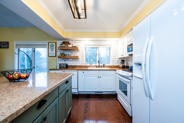 kitchen with white cabinets, dark hardwood / wood-style flooring, white appliances, and crown molding