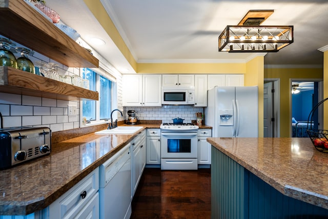 kitchen featuring dark hardwood / wood-style flooring, white appliances, white cabinetry, and sink