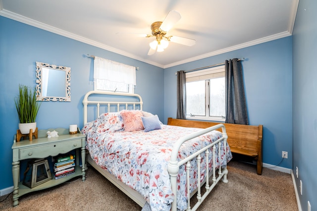 carpeted bedroom featuring ceiling fan and ornamental molding