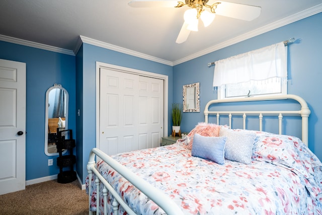 carpeted bedroom with a closet, ceiling fan, and ornamental molding