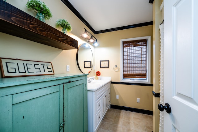 bathroom featuring vanity, tile patterned floors, and crown molding