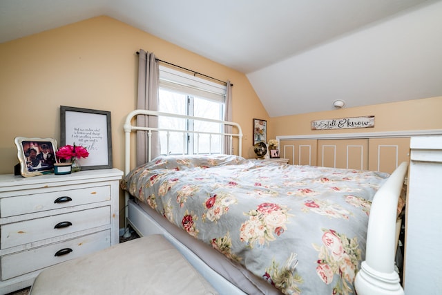 bedroom featuring vaulted ceiling