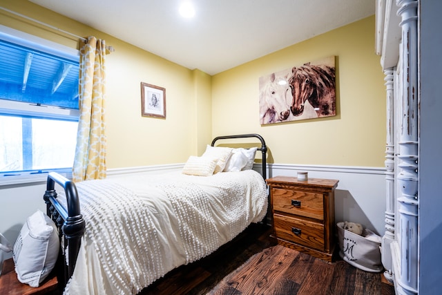 bedroom with dark wood-type flooring