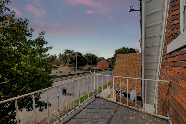 view of balcony at dusk