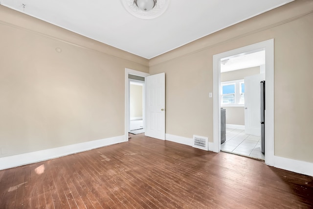 interior space featuring stainless steel refrigerator and light wood-type flooring