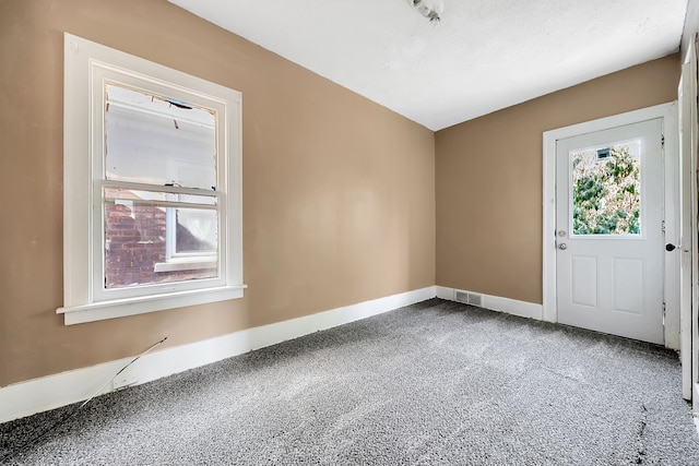 unfurnished room with carpet floors