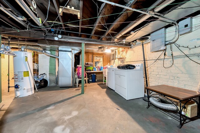 776 Woodmere St, Detroit, MI 48209 - unfinished basement featuring water heater and independent washer and dryer