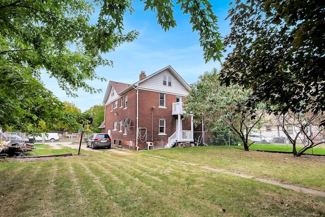 back of house featuring a yard